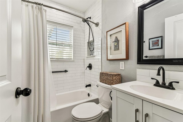 610 N Woodlynne Ave, Tampa, FL 33609 - bathroom with toilet, vanity, a textured wall, and shower / bath combo with shower curtain