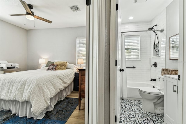 610 N Woodlynne Ave, Tampa, FL 33609 - bedroom featuring visible vents, wood finished floors, and ceiling fan