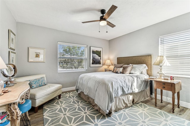 610 N Woodlynne Ave, Tampa, FL 33609 - bedroom with baseboards, wood finished floors, and ceiling fan