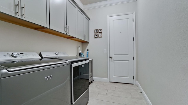 16612 5th Ave E, Bradenton, FL 34212 - laundry area featuring washer and clothes dryer, cabinet space, crown molding, and light tile patterned floors