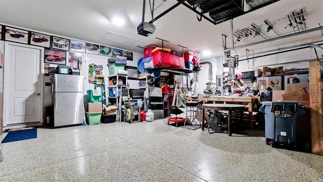 16612 5th Ave E, Bradenton, FL 34212 - garage featuring freestanding refrigerator and a garage door opener