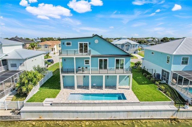 3496 Amberjack Dr, Hernando Beach, FL 34607 - rear view of house featuring a balcony, a residential view, central air condition unit, a patio, and a hot tub