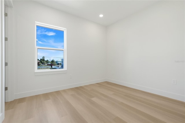3496 Amberjack Dr, Hernando Beach, FL 34607 - empty room featuring light wood-type flooring, baseboards, and recessed lighting