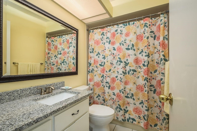 full bathroom with curtained shower, toilet, tile patterned flooring, and vanity