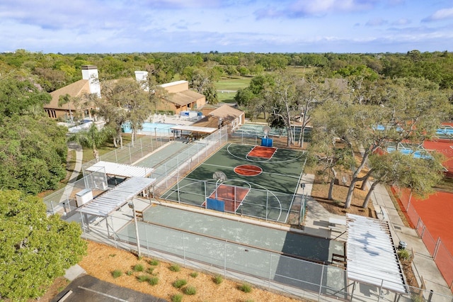 drone / aerial view featuring a forest view