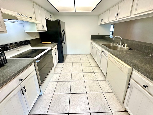 kitchen featuring white dishwasher, a sink, under cabinet range hood, light tile patterned flooring, and range with electric stovetop