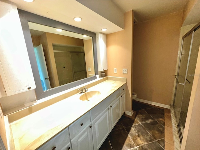 bathroom with a stall shower, recessed lighting, toilet, tile patterned flooring, and vanity