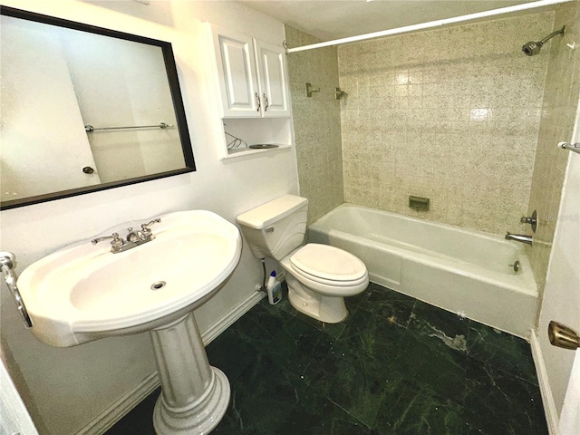 full bathroom featuring toilet, baseboards, marble finish floor, and shower / washtub combination