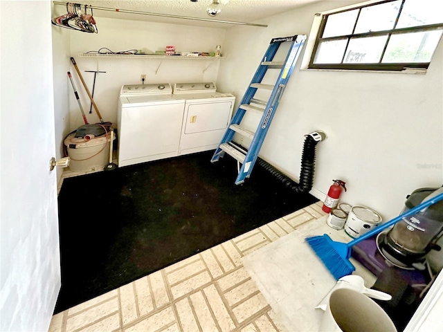 laundry room with washing machine and clothes dryer and laundry area