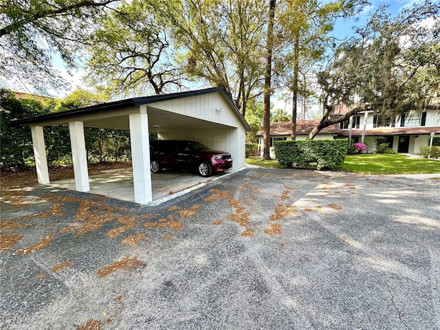 view of parking with a carport