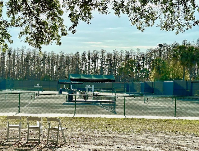 view of tennis court with fence