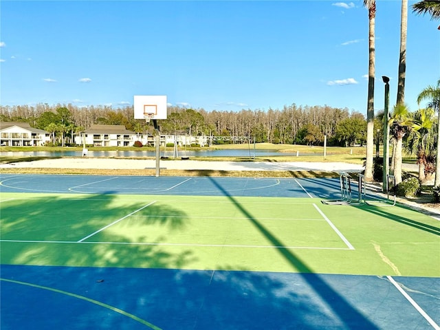 view of basketball court with a water view and community basketball court