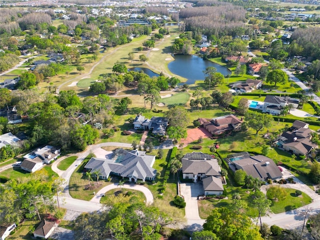 birds eye view of property with a water view, golf course view, and a residential view