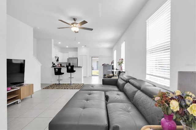 8299 Crescent Oaks Dr, New Port Richey, FL 34655 - living area with ceiling fan and light tile patterned floors