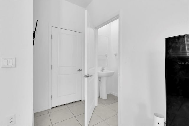 8299 Crescent Oaks Dr, New Port Richey, FL 34655 - interior space featuring light tile patterned flooring and a sink