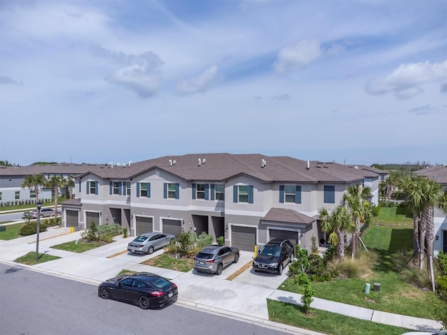 8299 Crescent Oaks Dr, New Port Richey, FL 34655 - view of property featuring a residential view, driveway, stucco siding, and an attached garage