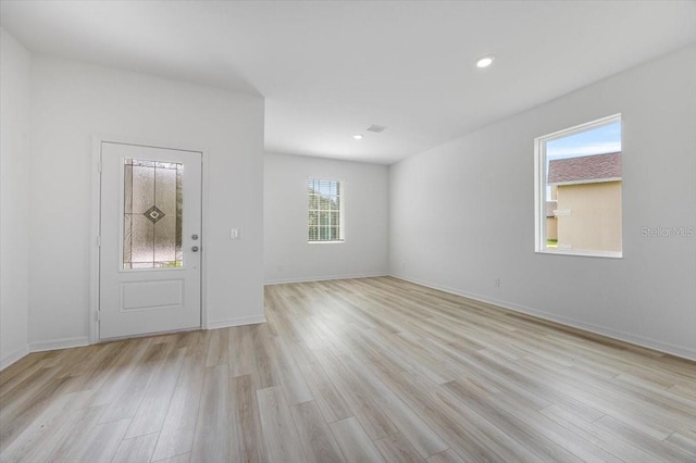 385 Begonia Ct, Poinciana, FL 34759 - entryway with light wood-style floors, baseboards, and recessed lighting