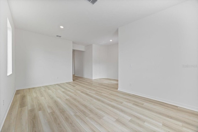 385 Begonia Ct, Poinciana, FL 34759 - unfurnished room featuring light wood-type flooring, recessed lighting, and baseboards