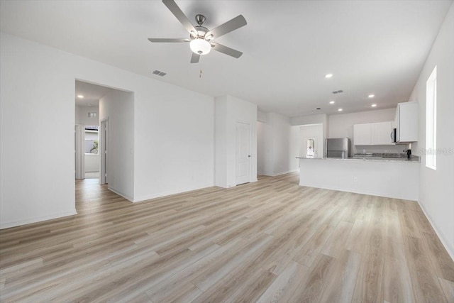 385 Begonia Ct, Poinciana, FL 34759 - unfurnished living room featuring ceiling fan, light wood-type flooring, recessed lighting, and baseboards