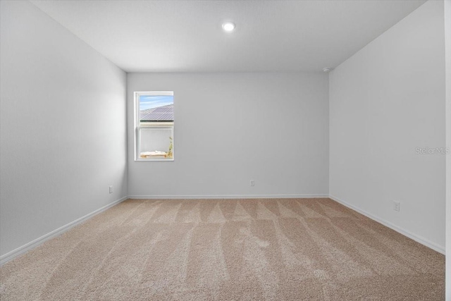 385 Begonia Ct, Poinciana, FL 34759 - empty room with light colored carpet and baseboards