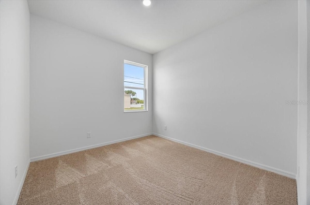 385 Begonia Ct, Poinciana, FL 34759 - carpeted empty room with baseboards