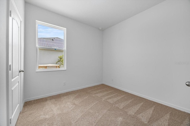 385 Begonia Ct, Poinciana, FL 34759 - empty room with carpet floors and baseboards