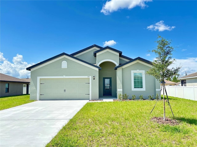 385 Begonia Ct, Poinciana, FL 34759 - ranch-style house with an attached garage, stucco siding, and concrete driveway