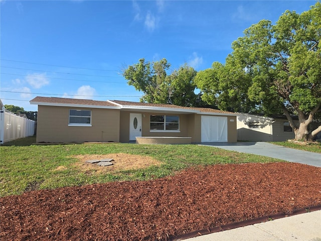 5130 Tilson Dr, New Port Richey, FL 34652 - ranch-style home with a front yard, driveway, and fence
