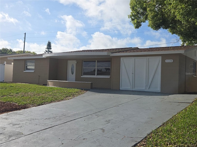 5130 Tilson Dr, New Port Richey, FL 34652 - view of front facade featuring a front lawn