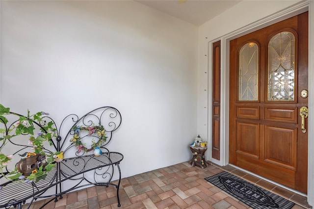view of exterior entry with stucco siding