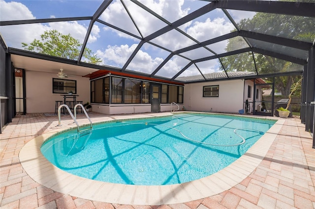 swimming pool featuring ceiling fan and a patio area