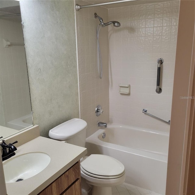 bathroom with toilet, vanity, shower / bath combination, and a textured wall