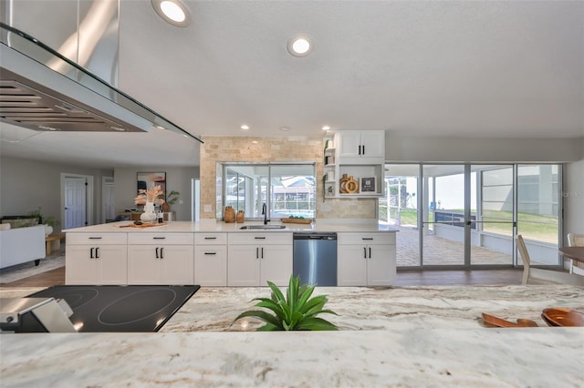 kitchen featuring a sink, recessed lighting, white cabinets, and dishwasher