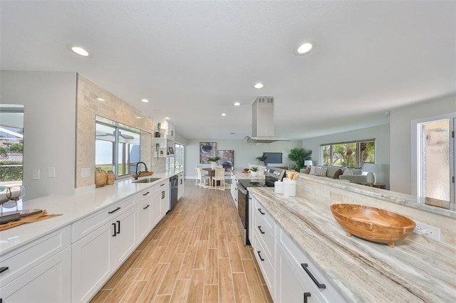 kitchen featuring range hood, a sink, white cabinetry, stainless steel range with electric stovetop, and wood tiled floor
