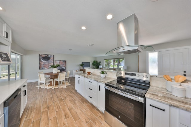 kitchen featuring stainless steel appliances, island exhaust hood, white cabinets, light wood-style floors, and recessed lighting