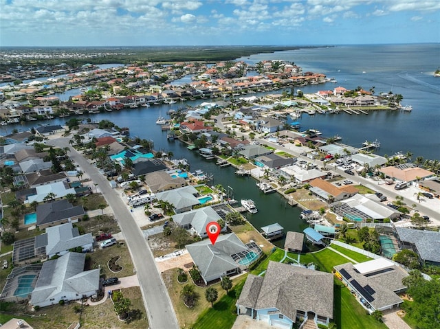 aerial view with a water view and a residential view