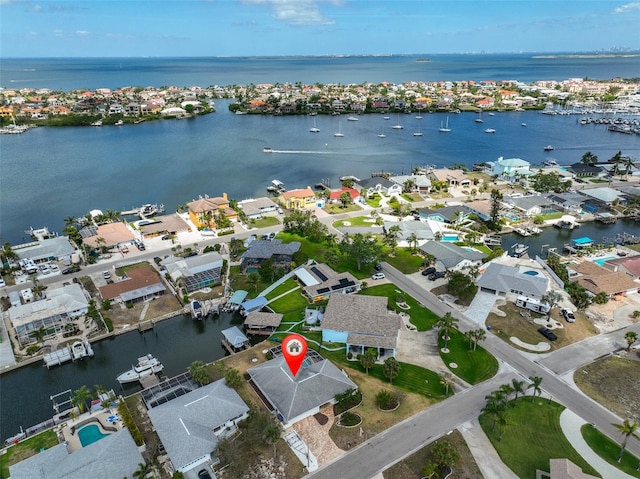 birds eye view of property featuring a water view