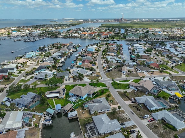 bird's eye view with a water view and a residential view