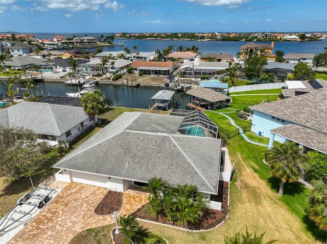 birds eye view of property featuring a water view and a residential view