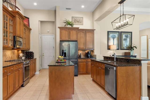 14817 Tudor Chase Dr, Tampa, FL 33626 - kitchen with a center island with sink, appliances with stainless steel finishes, backsplash, and recessed lighting