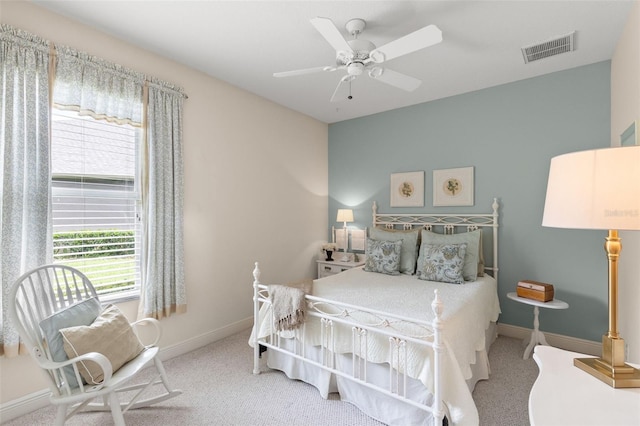 14817 Tudor Chase Dr, Tampa, FL 33626 - carpeted bedroom with baseboards and ceiling fan