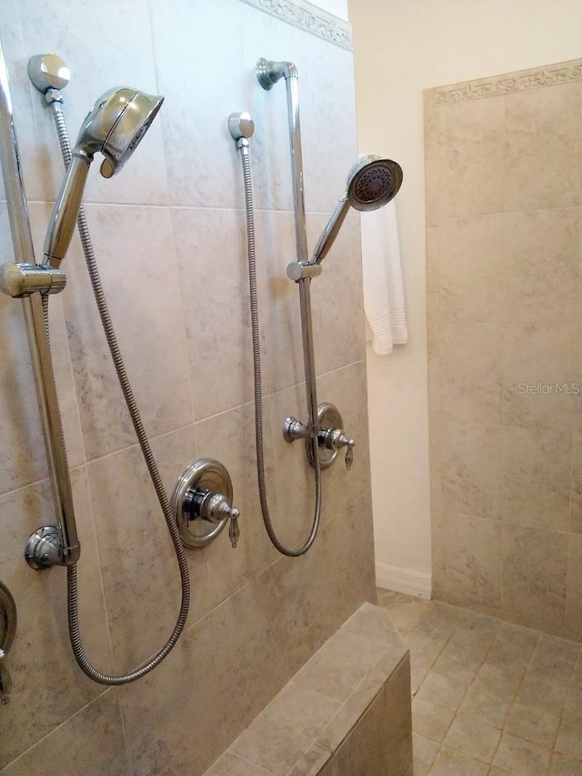 full bathroom with a tile shower