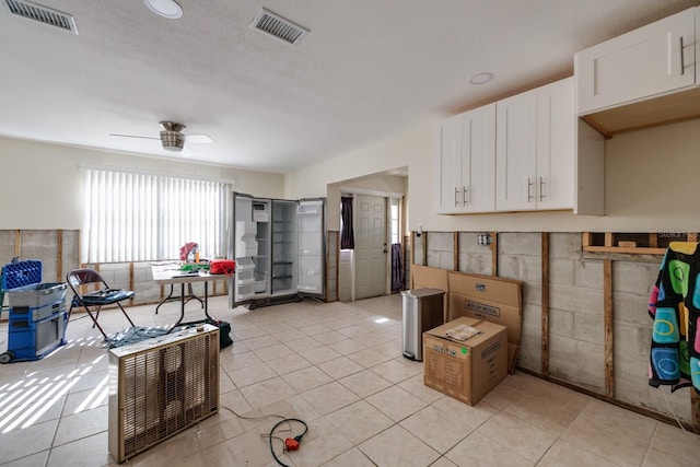 4126 Carson St NE, Saint Petersburg, FL 33703 - kitchen with visible vents, white cabinetry, and a ceiling fan
