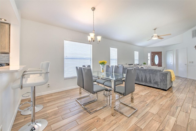 1666 Meadow Oak Ln, Tarpon Springs, FL 34689 - dining room with light wood-type flooring, lofted ceiling, and a ceiling fan