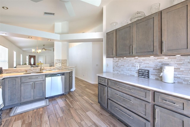 1666 Meadow Oak Ln, Tarpon Springs, FL 34689 - kitchen with dishwasher, ceiling fan, decorative backsplash, light countertops, and recessed lighting