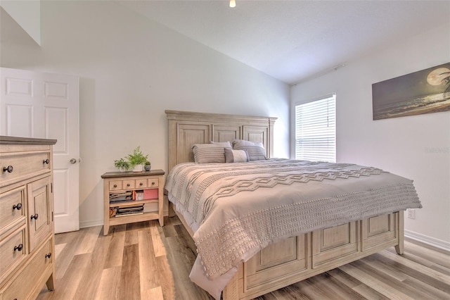 1666 Meadow Oak Ln, Tarpon Springs, FL 34689 - bedroom featuring vaulted ceiling and light wood-style floors