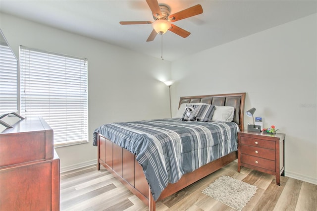 1666 Meadow Oak Ln, Tarpon Springs, FL 34689 - bedroom featuring light wood-type flooring and a ceiling fan