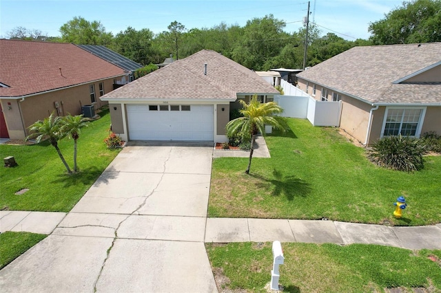 1666 Meadow Oak Ln, Tarpon Springs, FL 34689 - view of front facade with driveway, stucco siding, a shingled roof, and an attached garage