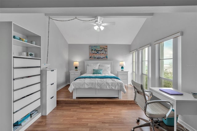 337 Rex Pl Unit E, Madeira Beach, FL 33708 - bedroom featuring vaulted ceiling, light wood-style flooring, an office area, baseboards, and a ceiling fan