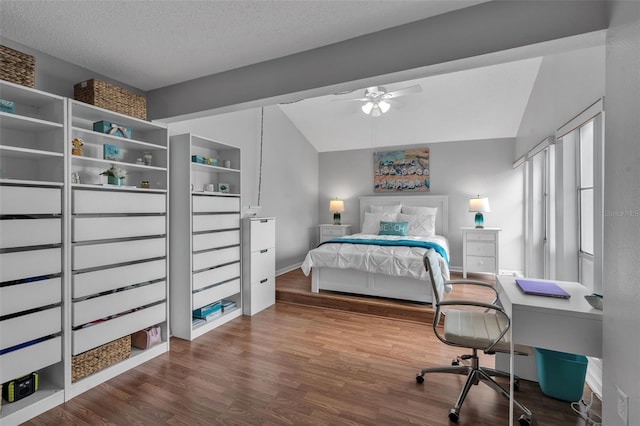 337 Rex Pl Unit E, Madeira Beach, FL 33708 - bedroom with wood finished floors, lofted ceiling, baseboards, a textured ceiling, and a ceiling fan